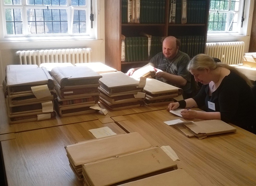 Some of our volunteers working hard cataloguing some of the community collections.